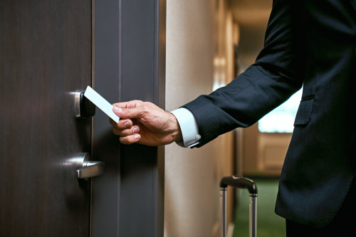 Close up of using keycard to open a secured door