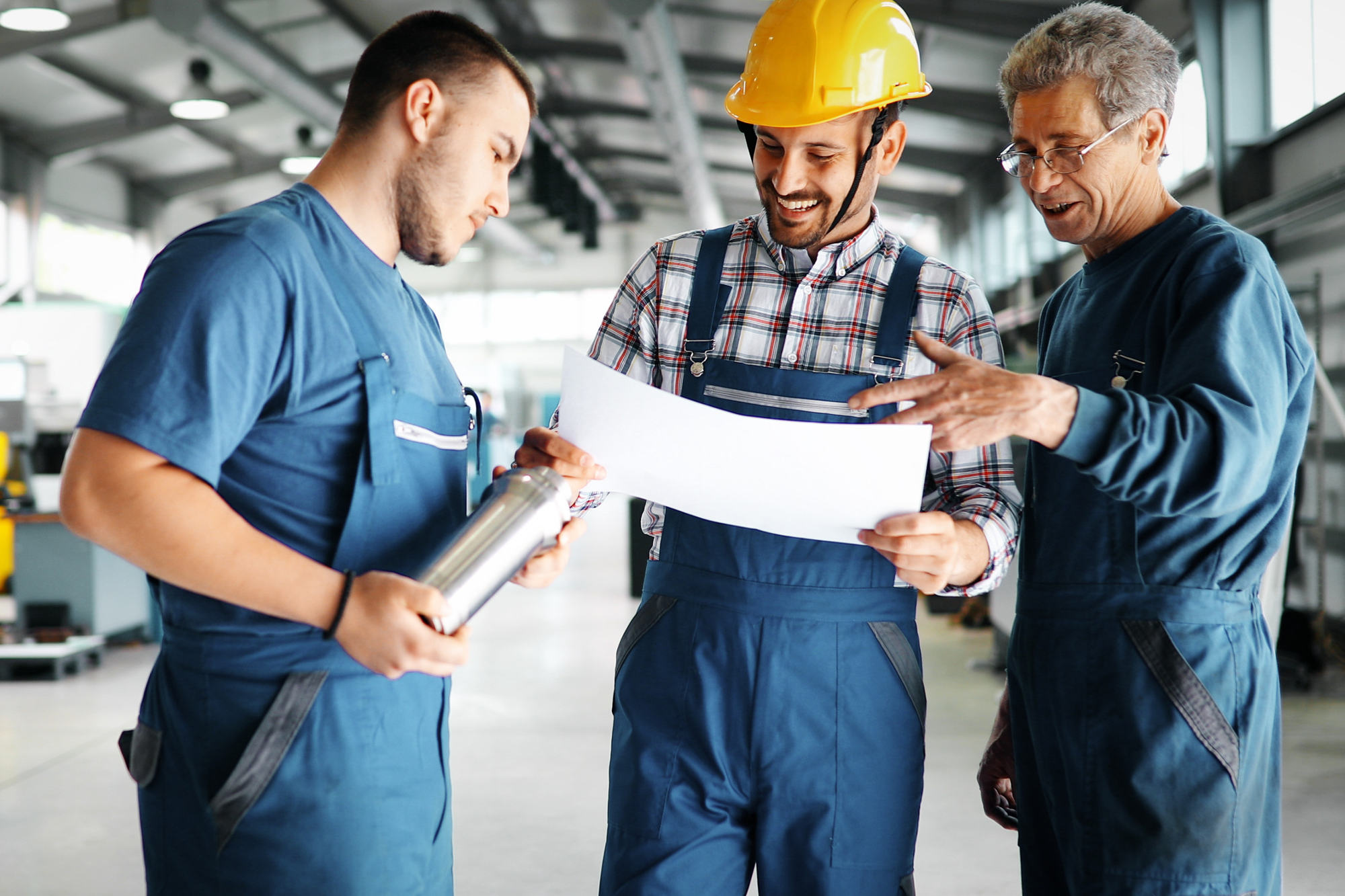 Professional working men looking at papers or charts
